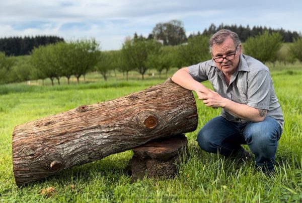 Natural beekeeping advocate and expert Alasdair Mackenzie with a hive log he installed at Blanchet Farm.