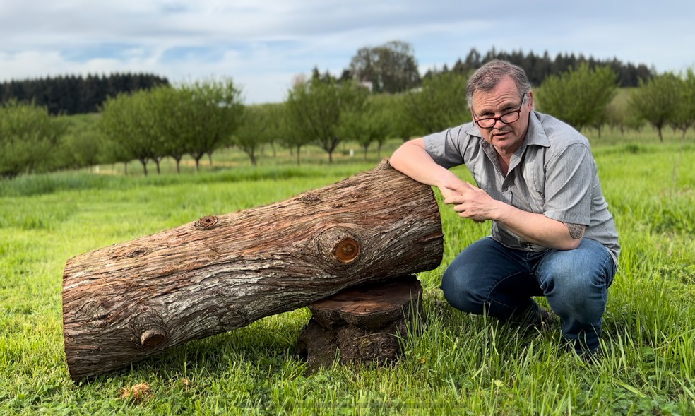 Natural beekeeping advocate and expert Alasdair Mackenzie with a hive log he installed at Blanchet Farm.