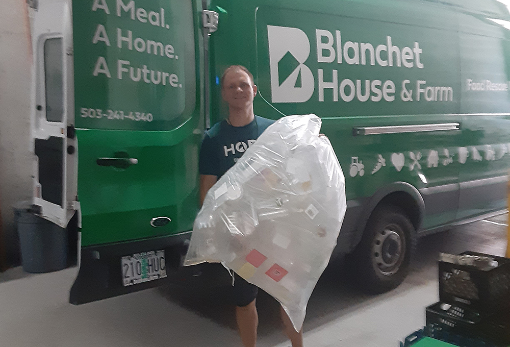 Chad Seelye holding plastic recycling