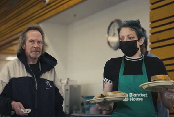 Diane volunteer serving Blanchet House cafe homeless services provider portland