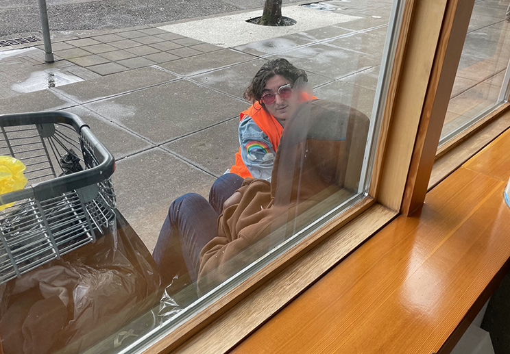 Duke Reiss talking with woman in crisis outside Blanchet House