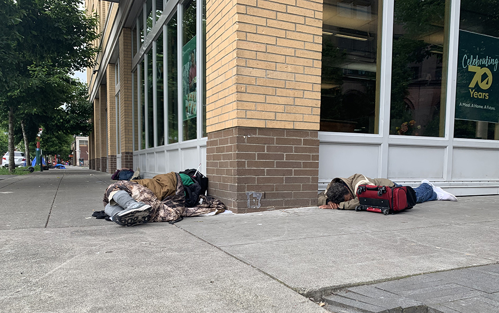 Homeless people sleeping on sidewalk in Portland