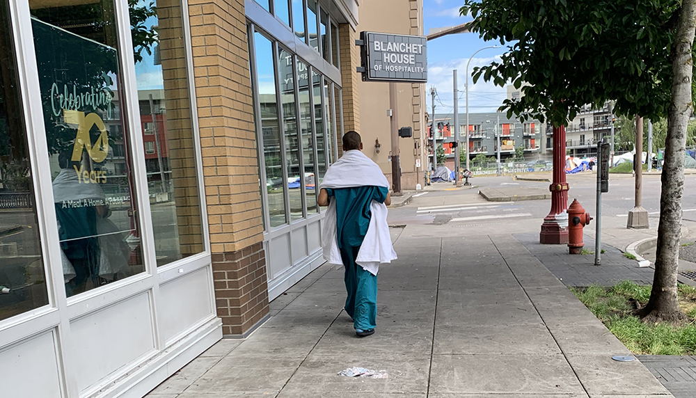 Untreated Mental Illness Woman walking in hospital scrubs