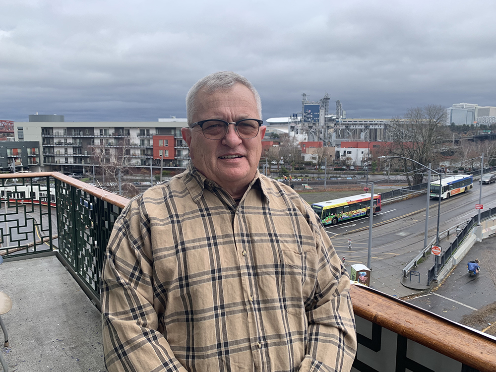John Andersson on balcony Blanchet House