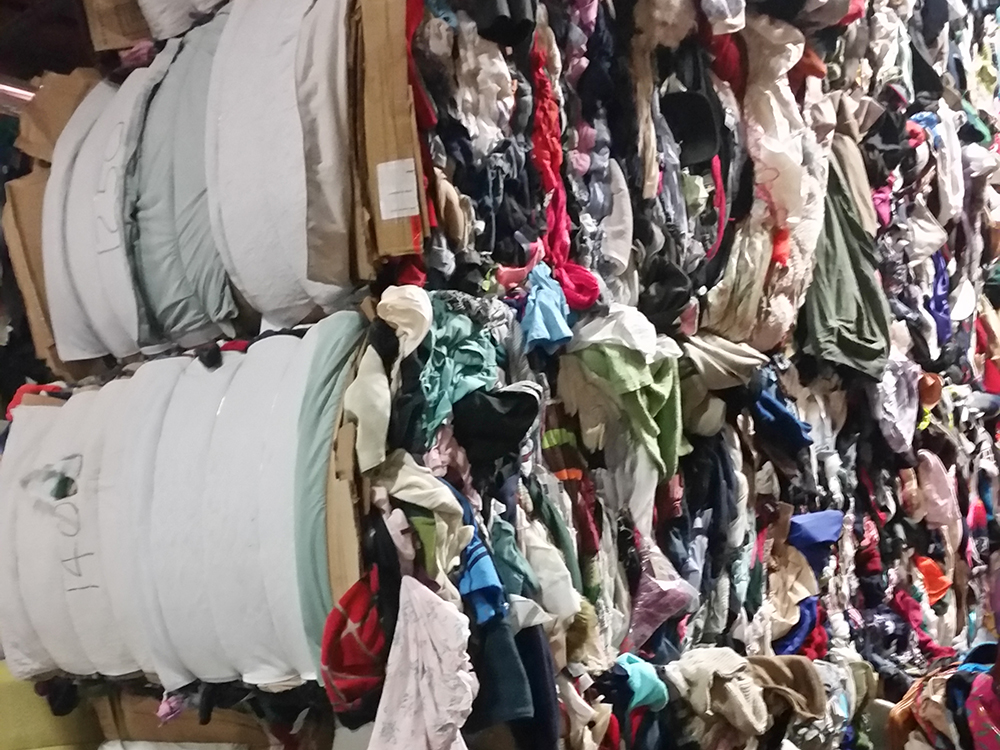 Bale of mixed rags from Pioneer Wiping Cloth a business that recycles clothes that a partner recycles into cleaning cloths