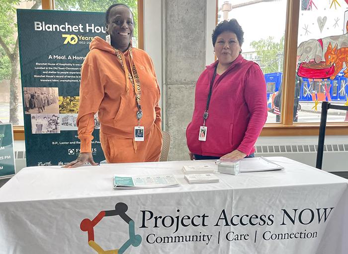 Project Access Now staff table in Blanchet House's cafe