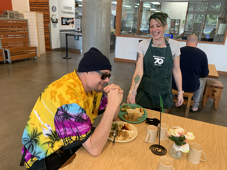 Volunteer serves in Blanchet House's cafe